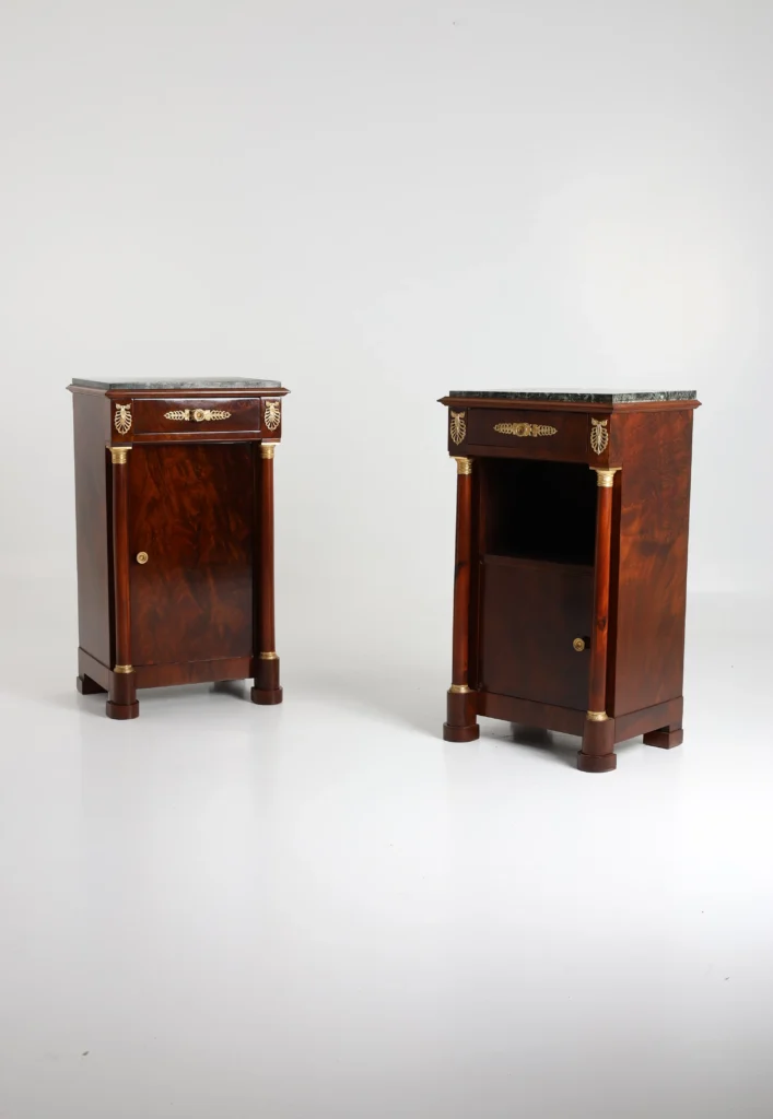 A pair of French Empire-style bedside cabinets