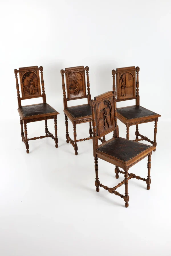 Set of Four French Henri II Carved Oak Dining Chairs with Figural Panels, Circa 1880